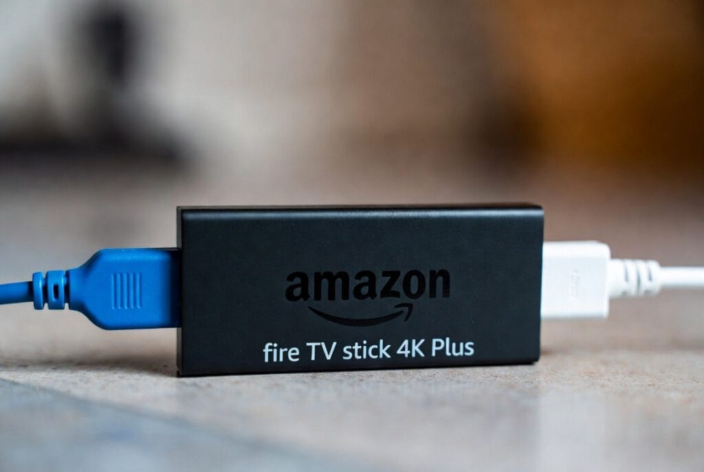 Fire TV Stick 4K streaming device with Alexa voice remote, shown in a clean product photo.